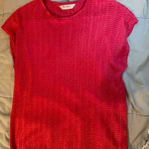 A hot pink shorts sleeve blouse.